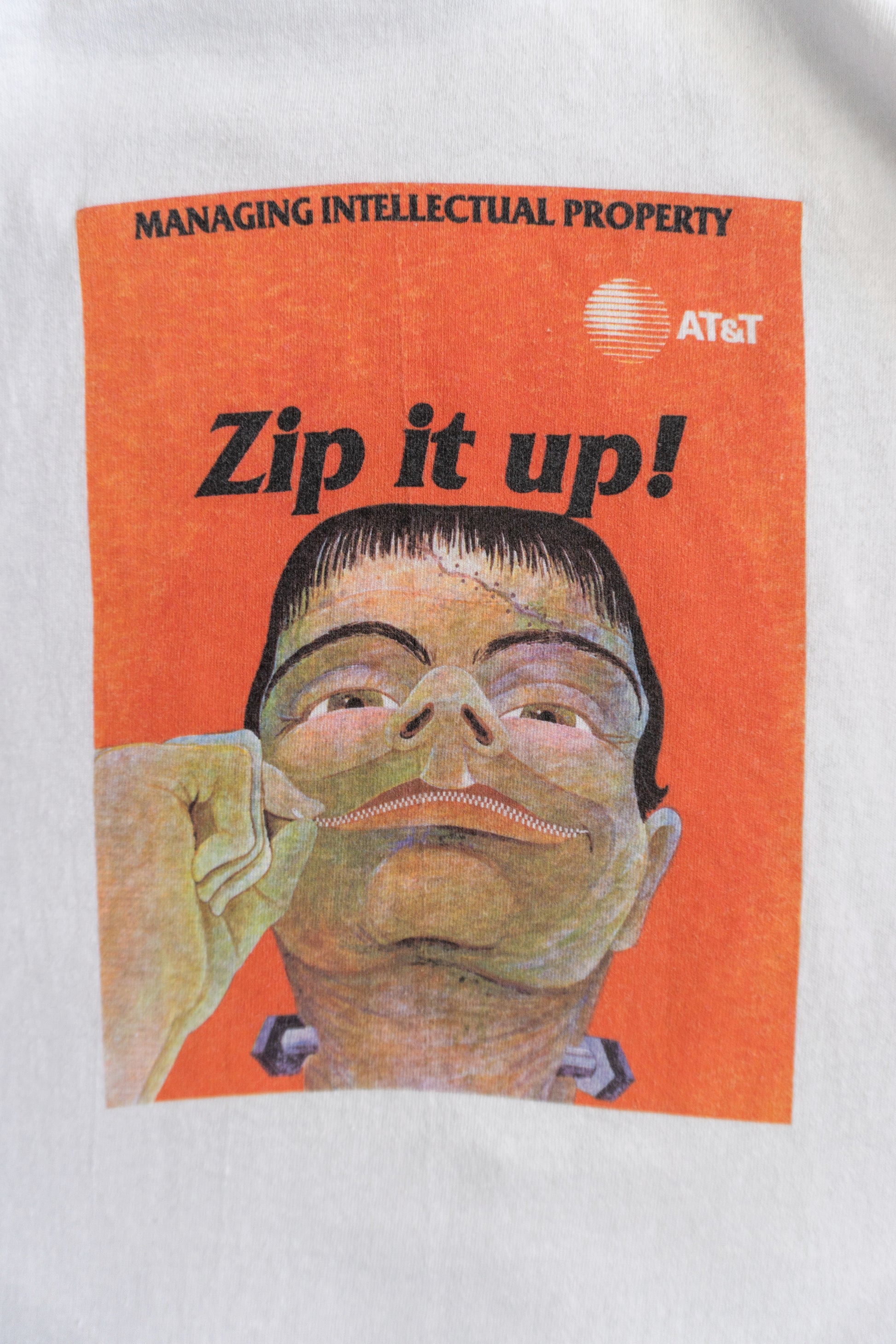 (L) 90’S VINTAGE AT&T “ZIP IT UP!” PROMO TEE